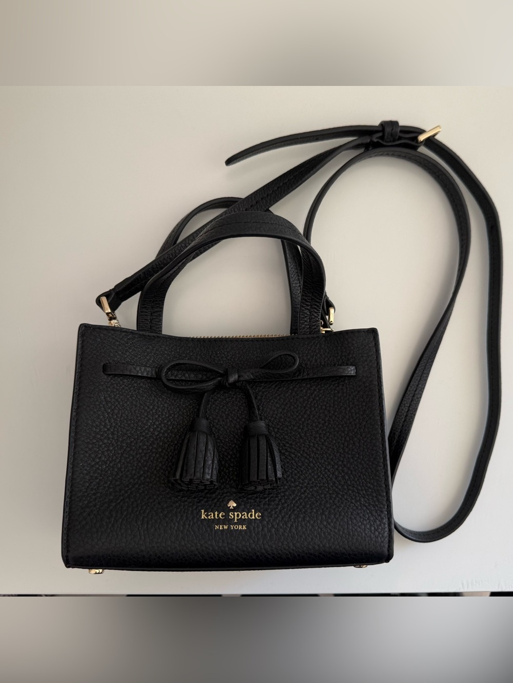 kate spade black pebbled leather crossbody with tassel bow